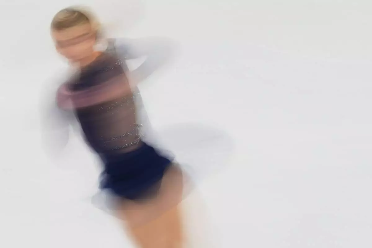 Amber Glenn of the United States warms up during the women's figure skating free program at the 2026 Winter Olympics, in Milan, Italy, Thursday, Feb. 19, 2026. (AP Photo/Francisco Seco)