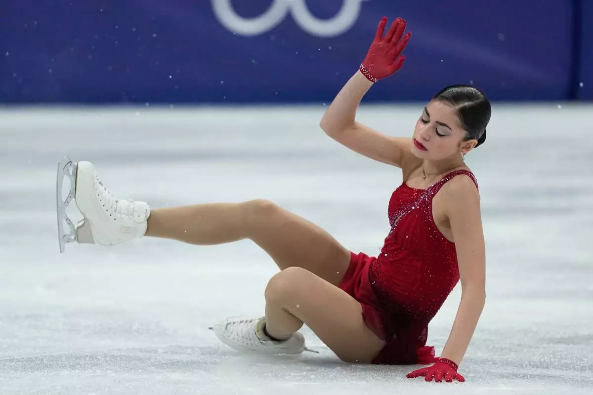 Adeliia Petrosian of Individual Neutral Athletes falls during the women's figure skating free program at the 2026 Winter Olympics, in Milan, Italy, Thursday, Feb. 19, 2026. (AP Photo/Natacha Pisarenko)