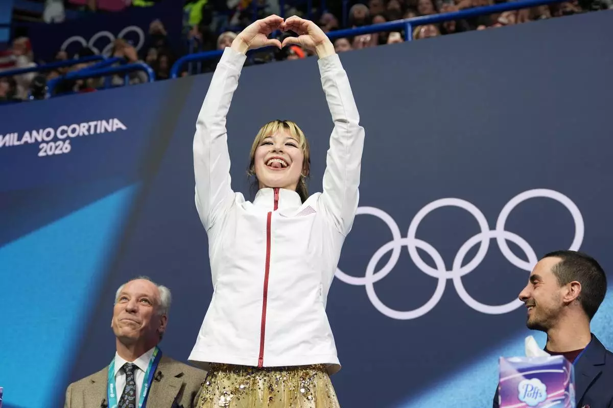 Alysa Liu of the United States reacts to her score after competing in the women's figure skating free program at the 2026 Winter Olympics, in Milan, Italy, Thursday, Feb. 19, 2026. (AP Photo/Stephanie Scarbrough)