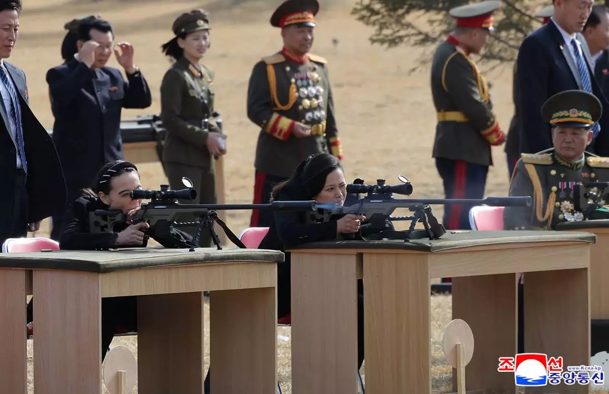 In this photo provided by the North Korean government, Kim Yo Jong, left, sister of its leader Kim Jong Un, and other senior officials test-fire new sniper rifles at a shooting range in an undisclosed location, North Korea Friday, Feb. 27, 2026. Independent journalists were not given access to cover the event depicted in this image distributed by the North Korean government. The content of this image is as provided and cannot be independently verified. Korean language watermark on image as provided by source reads: "KCNA" which is the abbreviation for Korean Central News Agency. (Korean Central News Agency/Korea News Service via AP)