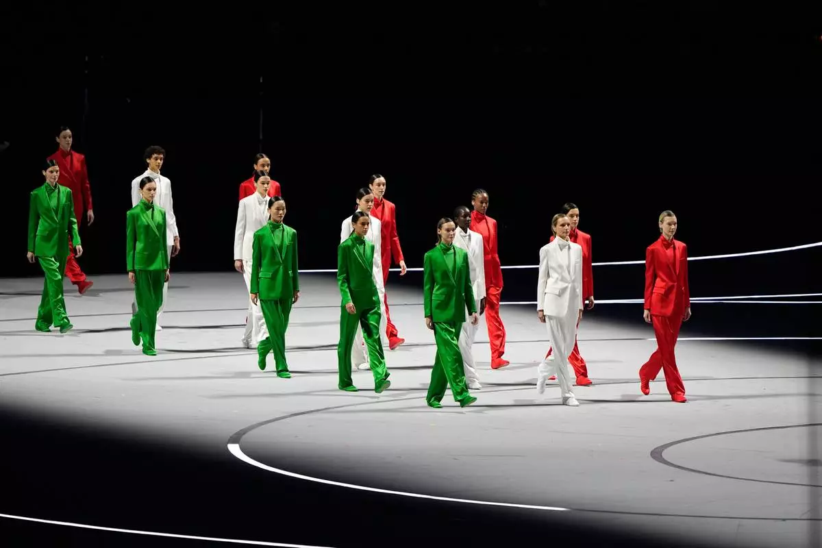 Models perform during the Olympic opening ceremony at the 2026 Winter Olympics, in Milan, Italy, Friday, Feb. 6, 2026. (AP Photo/Lee Jin-man)