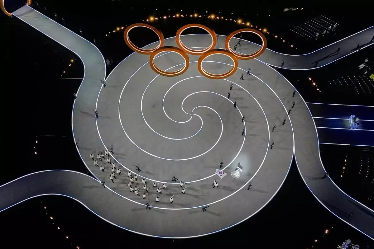 Team South Korea enters the stadium during the Olympic opening ceremony at the 2026 Winter Olympics, in Milan, Italy, Friday, Feb. 6, 2026. (AP Photo/David J. Phillip)