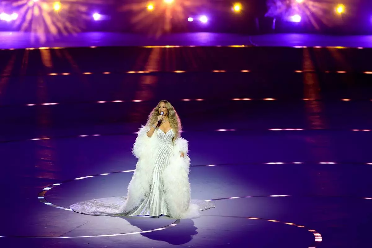 Mariah Carey performs at the Olympic opening ceremony at the 2026 Winter Olympics, in Milan, Italy, Friday, Feb. 6, 2026. (Andreas Rentz/Pool Photo via AP)