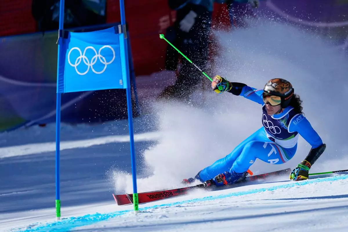 Italy's Federica Brignone speeds down the course, during an alpine ski, women's giant slalom race, at the 2026 Winter Olympics, in Cortina d'Ampezzo, Italy, Sunday, Feb. 15, 2026. (AP Photo/Robert F. Bukaty)