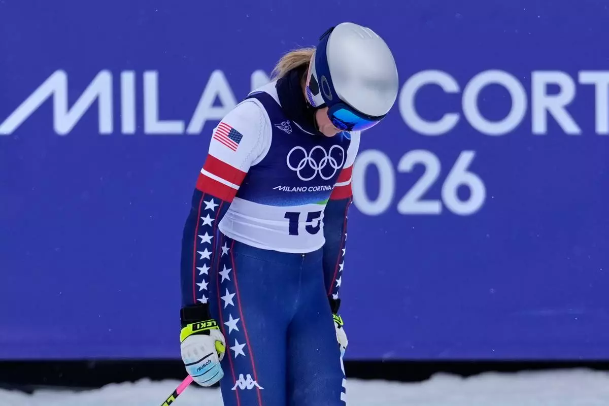 United States' Lindsey Vonn arrives at the finish area of an alpine ski women's downhill training, at the 2026 Winter Olympics, in Cortina d'Ampezzo, Italy, Saturday, Feb. 7, 2026. (AP Photo/Robert F. Bukaty)