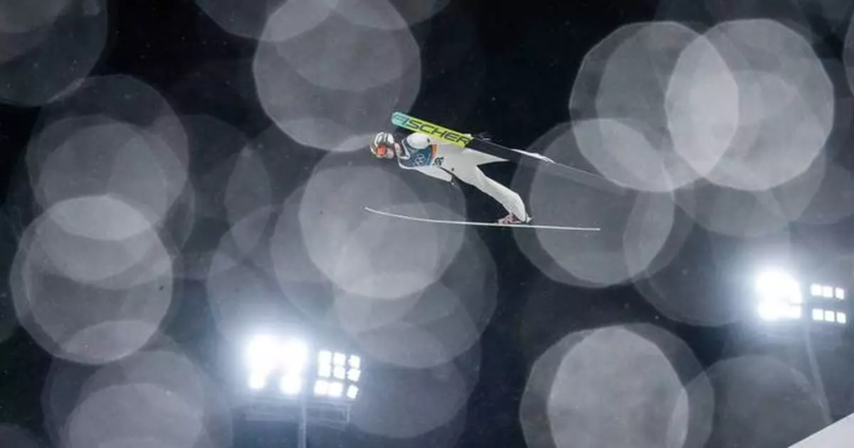 One Extraordinary Photo: Ski jumper glides through rain