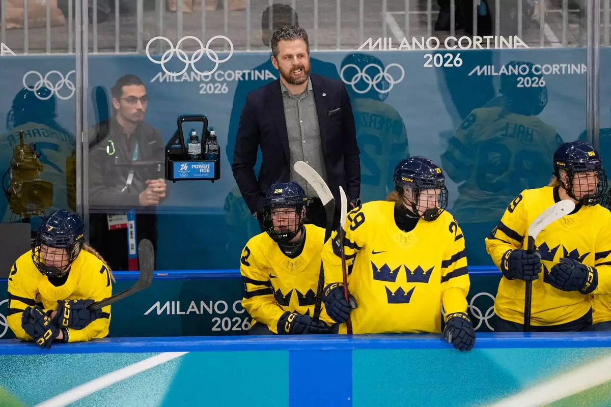 Sweden's Head Coach Ulf Lundberg gestures during a preliminary round match of women's ice hockey between France and Sweden at the 2026 Winter Olympics, in Milan, Italy, Sunday, Feb. 8, 2026. (AP Photo/Petr David Josek)