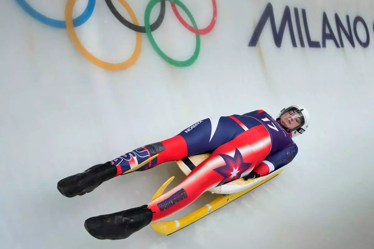 United States' Summer Britcher slides down the track during a women's single luge training session at the 2026 Winter Olympics, in Cortina d'Ampezzo, Italy, Saturday, Feb. 7, 2026. (AP Photo/Aijaz Rahi)