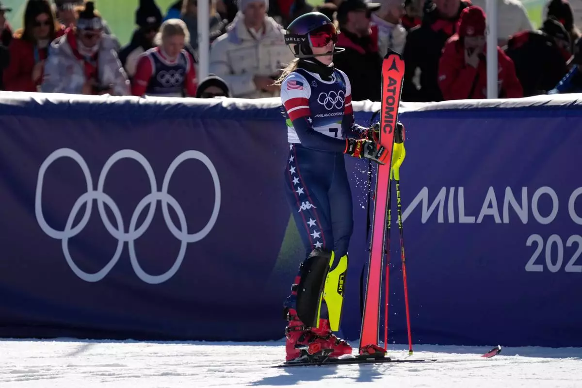 United States' Mikaela Shiffrin at the finish area of an alpine ski, women's slalom race, at the 2026 Winter Olympics, in Cortina d'Ampezzo, Italy, Wednesday, Feb. 18, 2026. (AP Photo/Andy Wong)