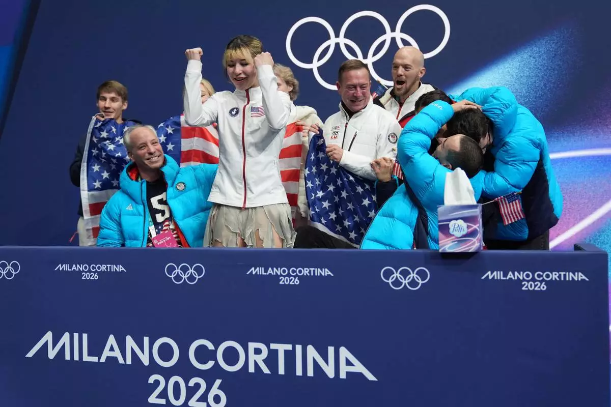 Alysa Lui of the United States reacts to her scores after competing during the figure skating women's team event at the 2026 Winter Olympics, in Milan, Italy, Friday, Feb. 6, 2026. (AP Photo/Stephanie Scarbrough)
