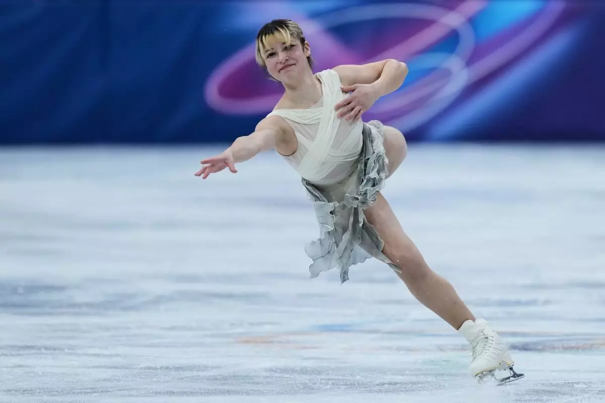 Alysa Lui of the United States competes during the figure skating women's team event at the 2026 Winter Olympics, in Milan, Italy, Friday, Feb. 6, 2026. (AP Photo/Stephanie Scarbrough)