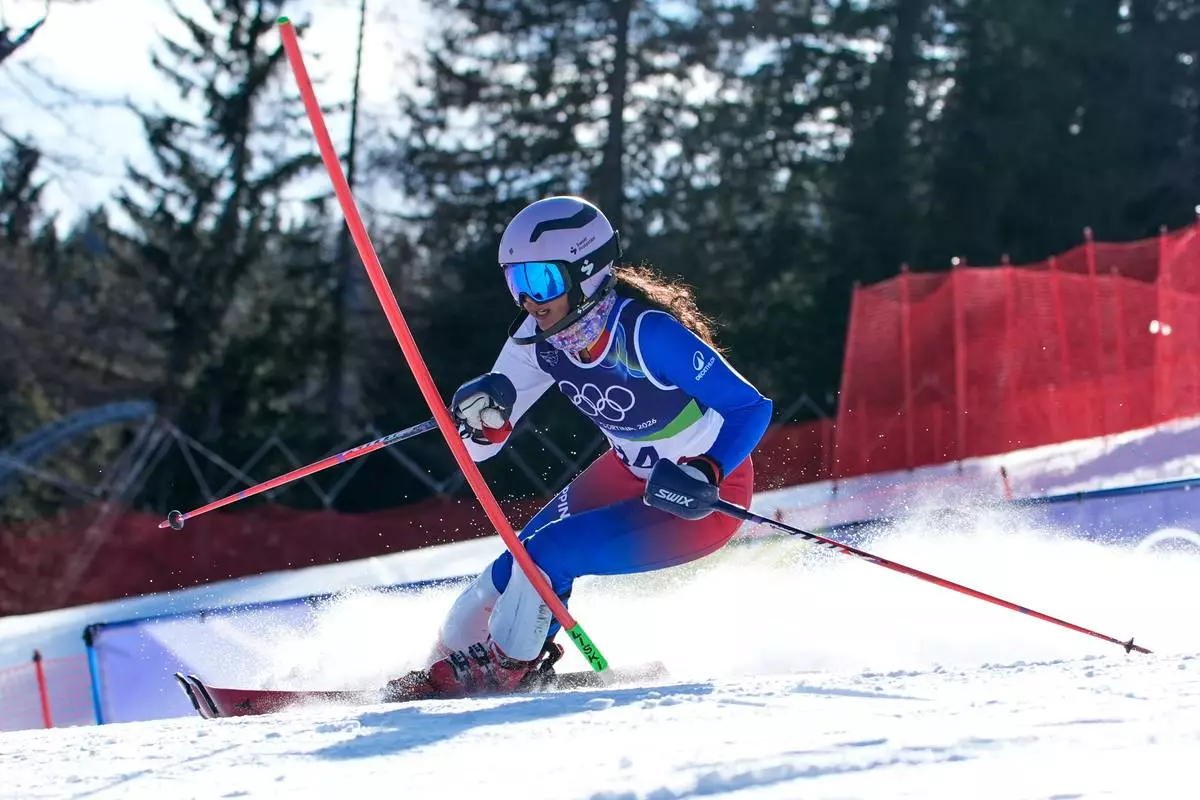 Philippine's Tallulah Proulx speeds down the course during an alpine ski, women's slalom race, at the 2026 Winter Olympics, in Cortina d'Ampezzo, Italy, Wednesday, Feb. 18, 2026. (AP Photo/Robert F. Bukaty)