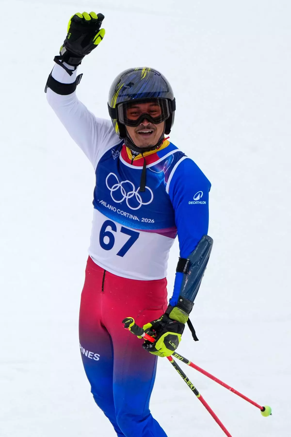 Philippines' Francis Ceccarelli reacts after completing an alpine ski, men's giant slalom race, at the 2026 Winter Olympics, in Bormio, Italy, Saturday, Feb. 14, 2026. (AP Photo/John Locher)