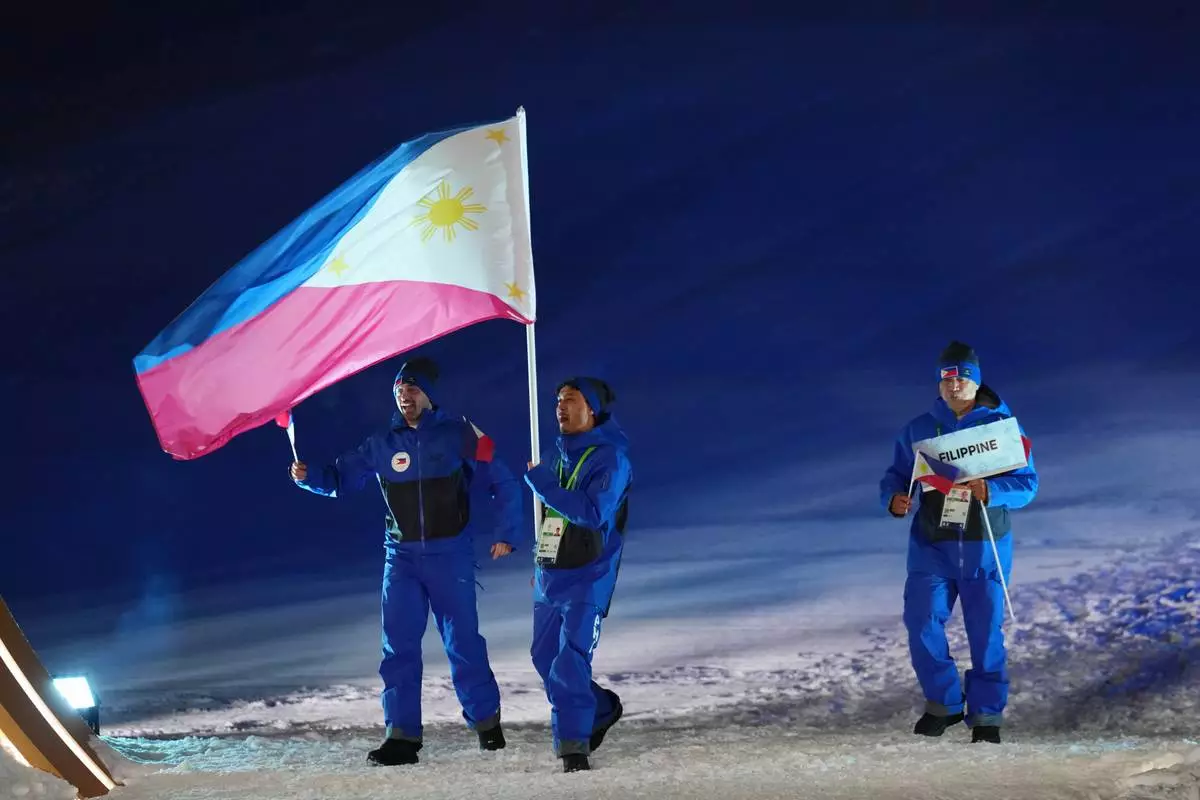Athletes from the Philippines walk during the Olympic opening ceremony at the 2026 Winter Olympics, in Livigno, Italy, Friday, Feb. 6, 2026. (AP Photo/Abbie Parr)