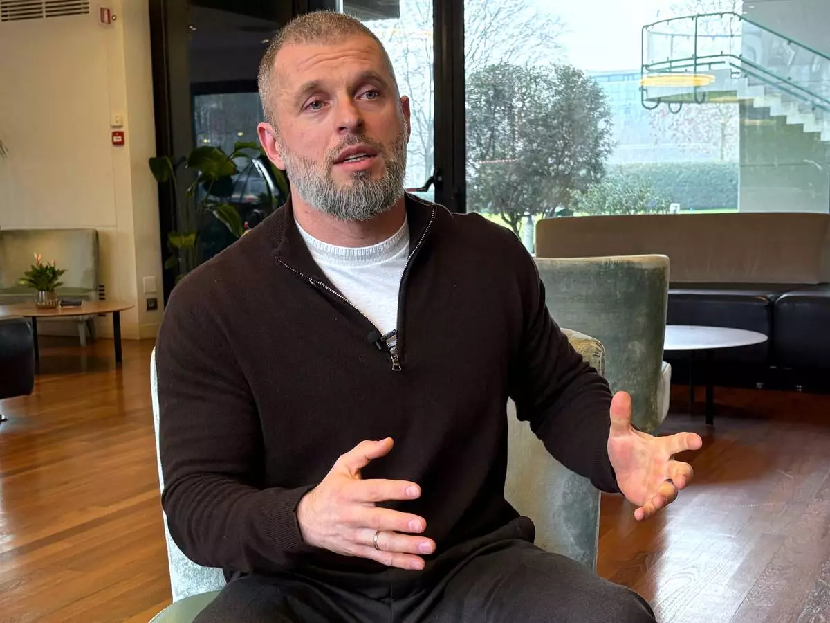 Ukrainian Sports Minister Matvii Bidnyi discusses the impact of the war in Ukraine on Olympic athletes, at the 2026 Winter Olympics, in Milan, Italy, Sunday, Feb. 8, 2026. (AP Photo/Stefanie Dazio)