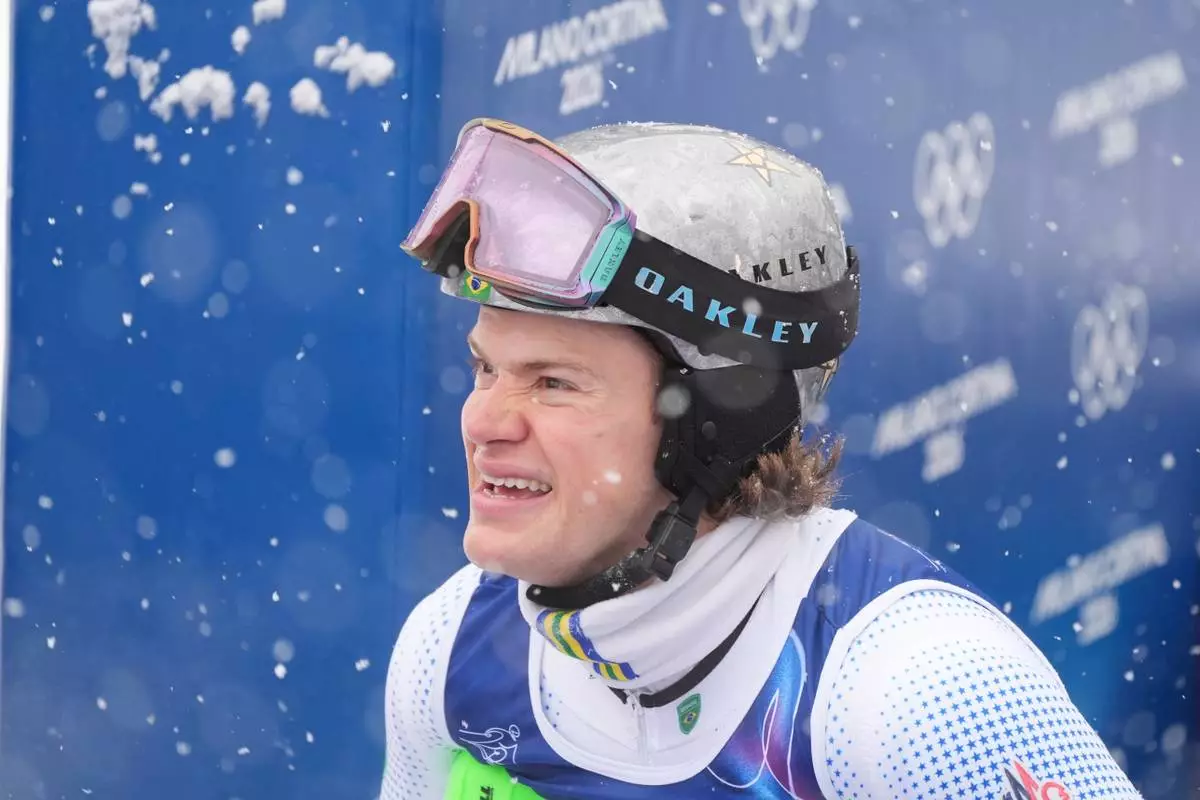 Brazil's Lucas Pinheiro Braathen reacts at the finish area of an alpine ski, men's slalom race, at the 2026 Winter Olympics, in Bormio, Italy, Monday, Feb. 16, 2026. (AP Photo/Rebecca Blackwell)