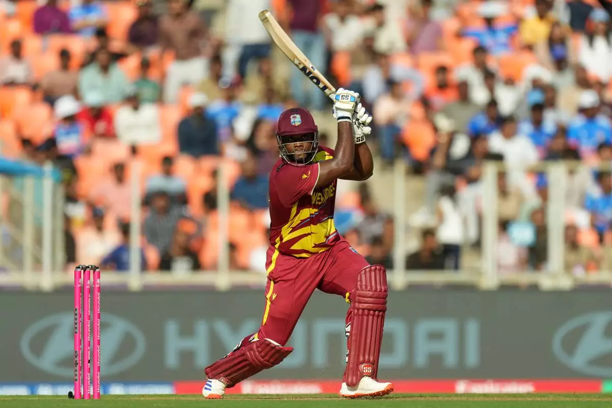 West Indies' Romario Shepherd plays a shot during the T20 World Cup cricket match between South Africa and West Indies in Ahmedabad, India, Thursday, Feb. 26, 2026. (AP Photo/Ajit Solanki)