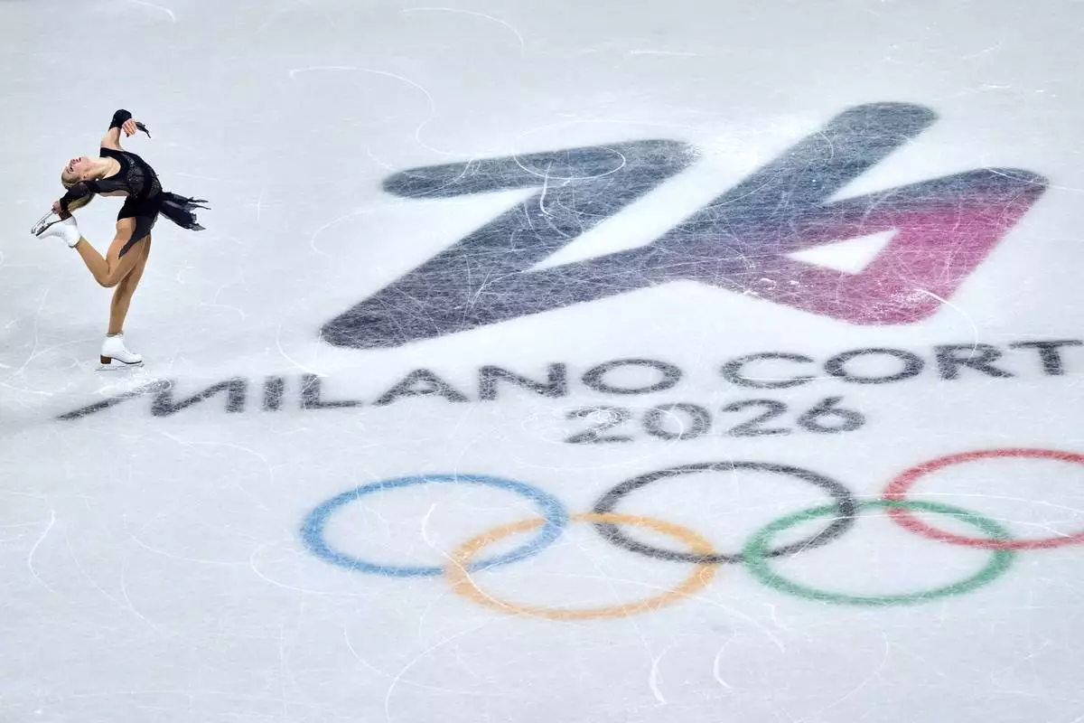 Amber Glenn of the United States competes during the figure skating women's team event at the 2026 Winter Olympics, in Milan, Italy, Sunday, Feb. 8, 2026. (AP Photo/Natacha Pisarenko)