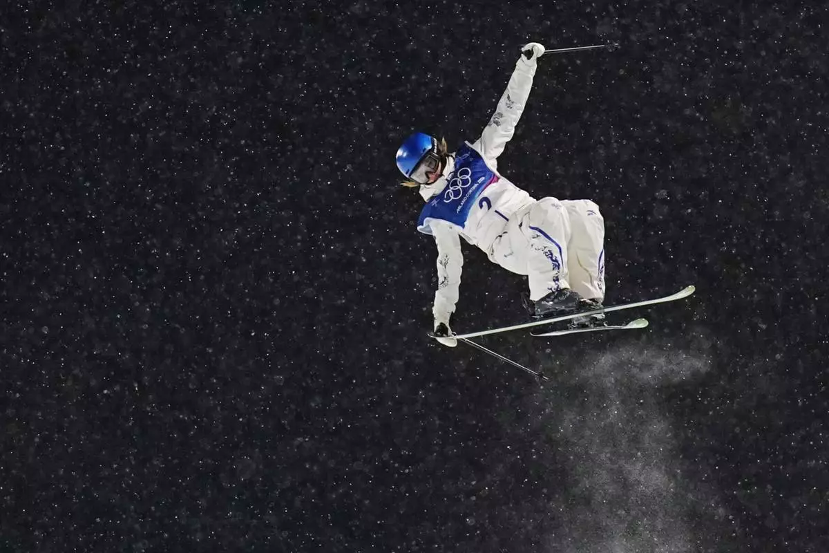 China's Eileen Gu competes during the women's freestyle skiing halfpipe qualifications at the 2026 Winter Olympics, in Livigno, Italy, Thursday, Feb. 19, 2026. (AP Photo/Gregory Bull)