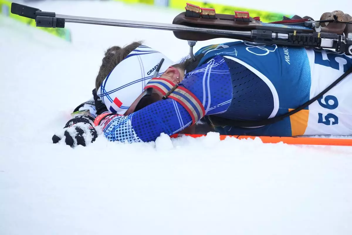 Silver medalist Oceane Michelon, of France, reacts after the women's 7.5-kilometer sprint biathlon race at the 2026 Winter Olympics in Anterselva, Italy, Saturday, Feb. 14, 2026. (AP Photo/Andrew Medichini)