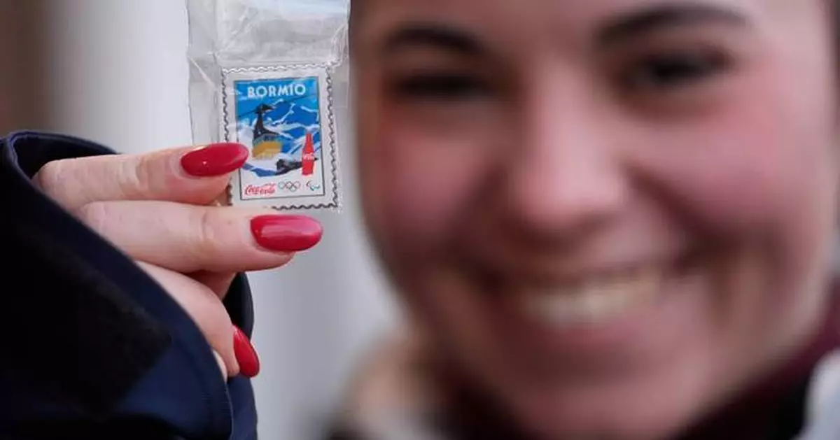 Olympic pin mania has collectors running between landmarks and swarming a trading center