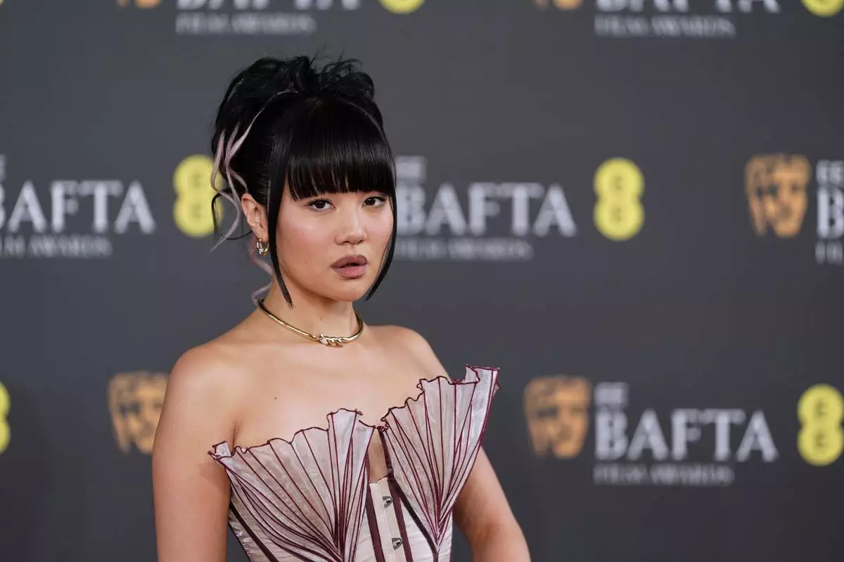 Rei Ami poses for photographers upon arrival at the 79th British Academy Film Awards, BAFTA's, in London, Sunday, Feb. 22, 2026. (AP Photo/Alberto Pezzali)