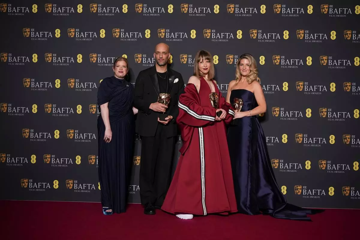 Lauren Frankfort Meltzer, from left, Matt Houghton, Georgie Wileman, and Harriette Wright pose with the award for British short film for 'This Is Endometriosis' at the 79th British Academy Film Awards, BAFTA's, in London, Sunday, Feb. 22, 2026. (AP Photo/Alastair Grant)
