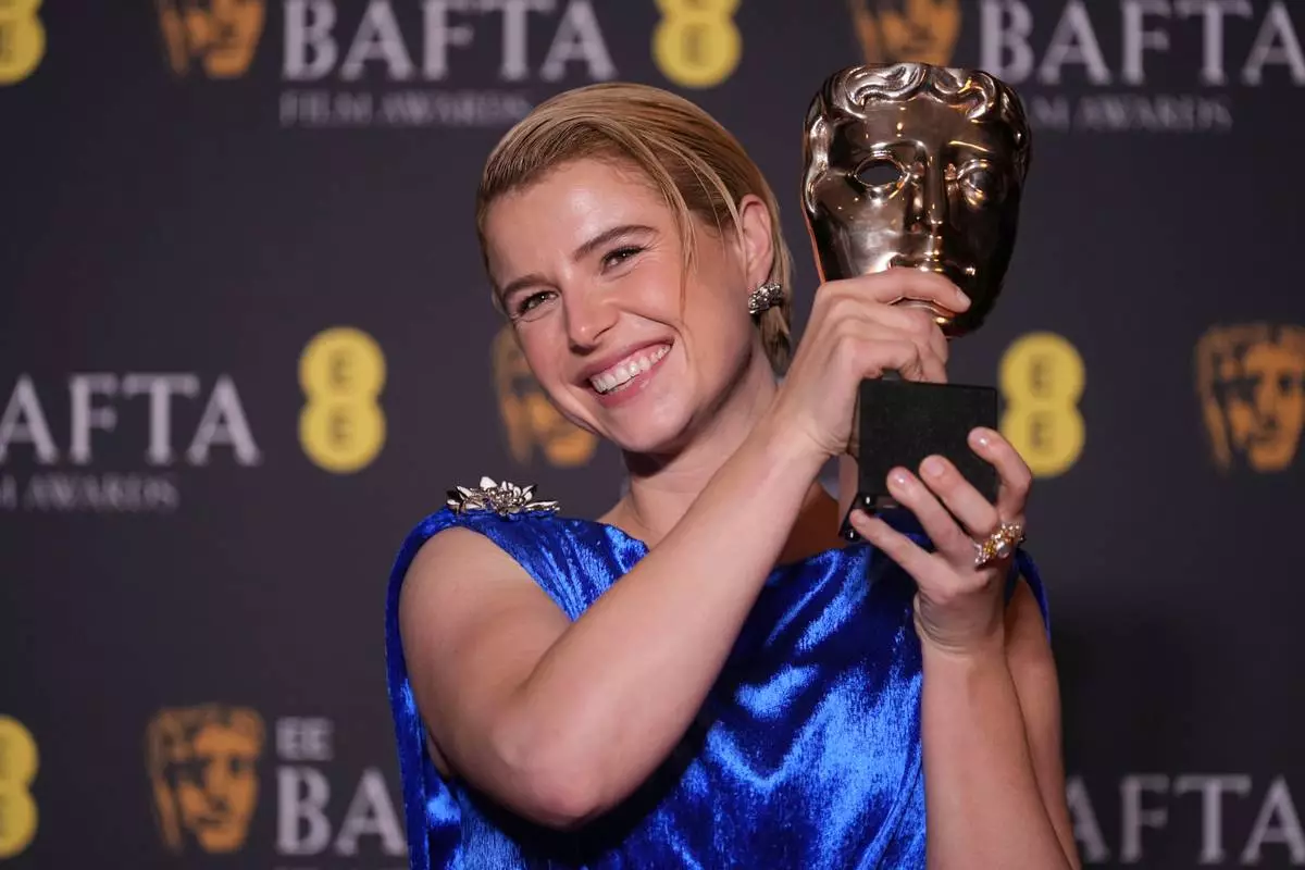Jessie Buckley poses with the award for leading actress for 'Hamnet' at the 79th British Academy Film Awards, BAFTA's, in London, Sunday, Feb. 22, 2026. (AP Photo/Alastair Grant)