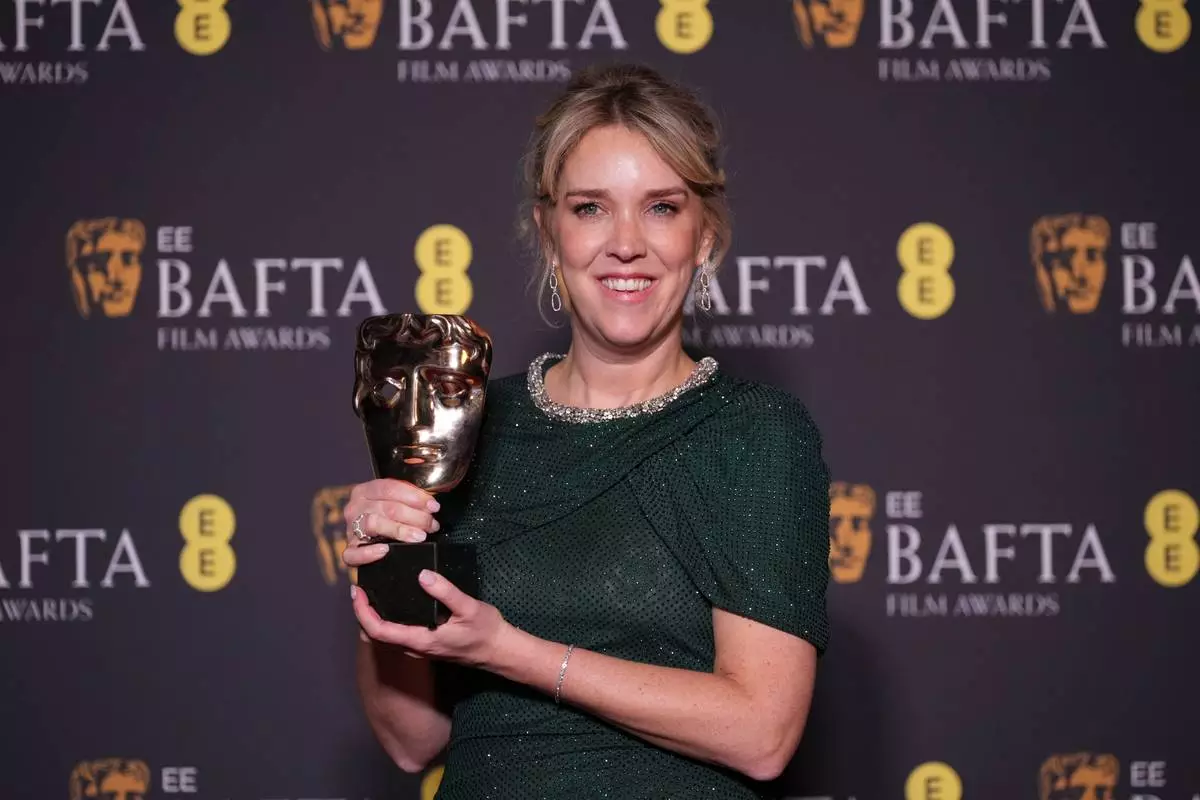 Lauren Evans poses with the award for casting for 'I Swear' at the 79th British Academy Film Awards, BAFTA's, in London, Sunday, Feb. 22, 2026. (AP Photo/Alastair Grant)