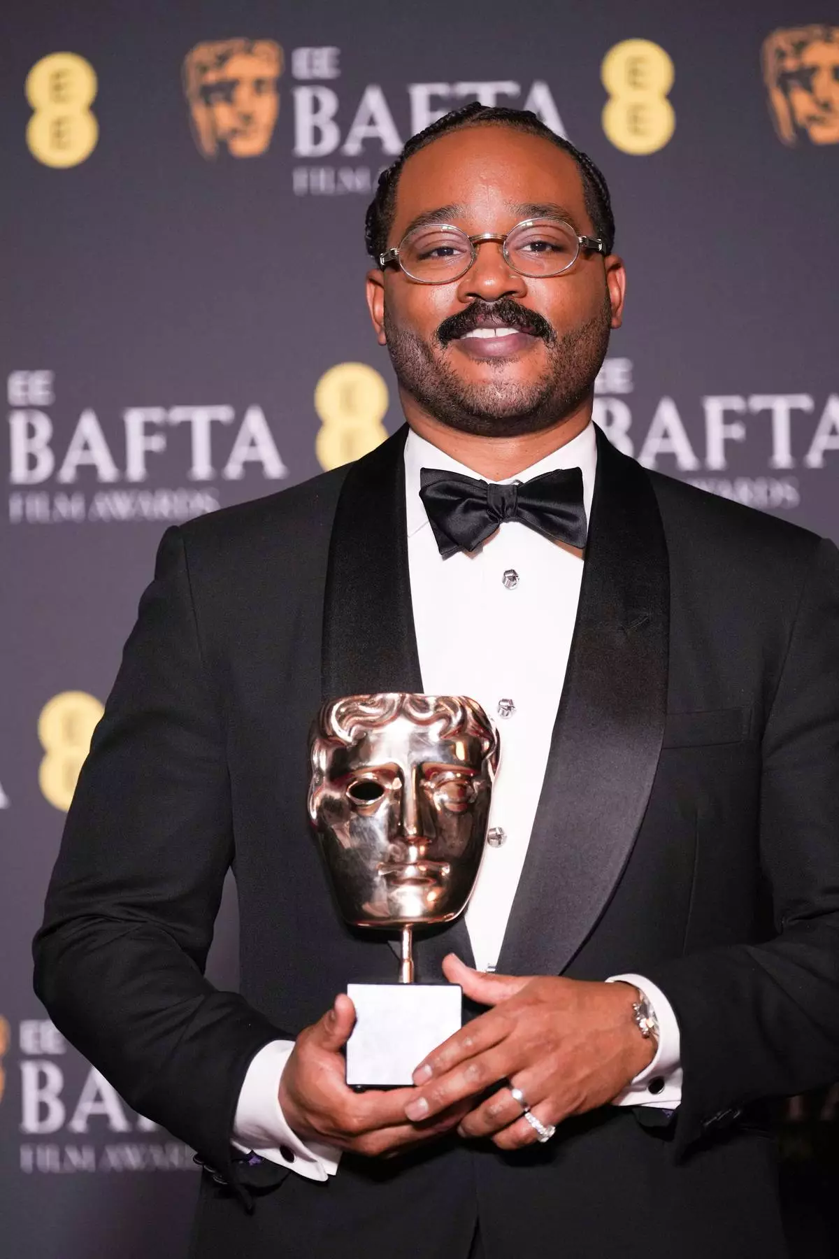 Ryan Coogler poses with the award for original screenplay for 'Sinners' at the 79th British Academy Film Awards, BAFTA's, in London, Sunday, Feb. 22, 2026. (AP Photo/Alastair Grant)