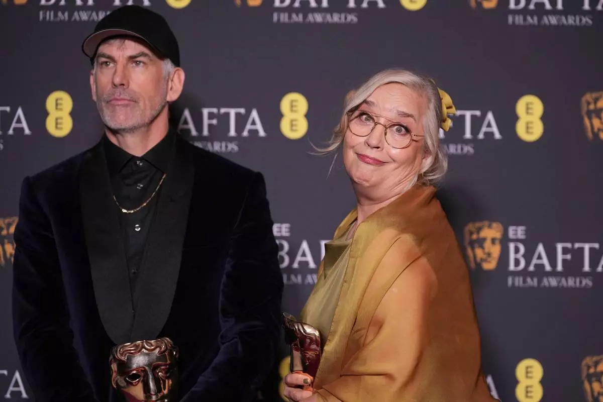 Shane Vieau, Tamara Deverell pose with the award for production design for 'Frankenstein'at the 79th British Academy Film Awards, BAFTA's, in London, Sunday, Feb. 22, 2026. (AP Photo/Alastair Grant)