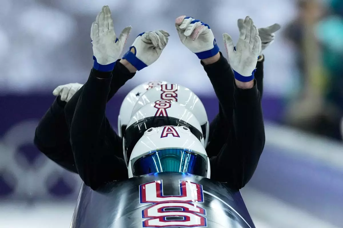 United States' Frankie del Duca, front, starts for a four man bobsled training session at the 2026 Winter Olympics, in Cortina d'Ampezzo, Italy, Thursday, Feb. 19, 2026. (AP Photo/Alessandra Tarantino)