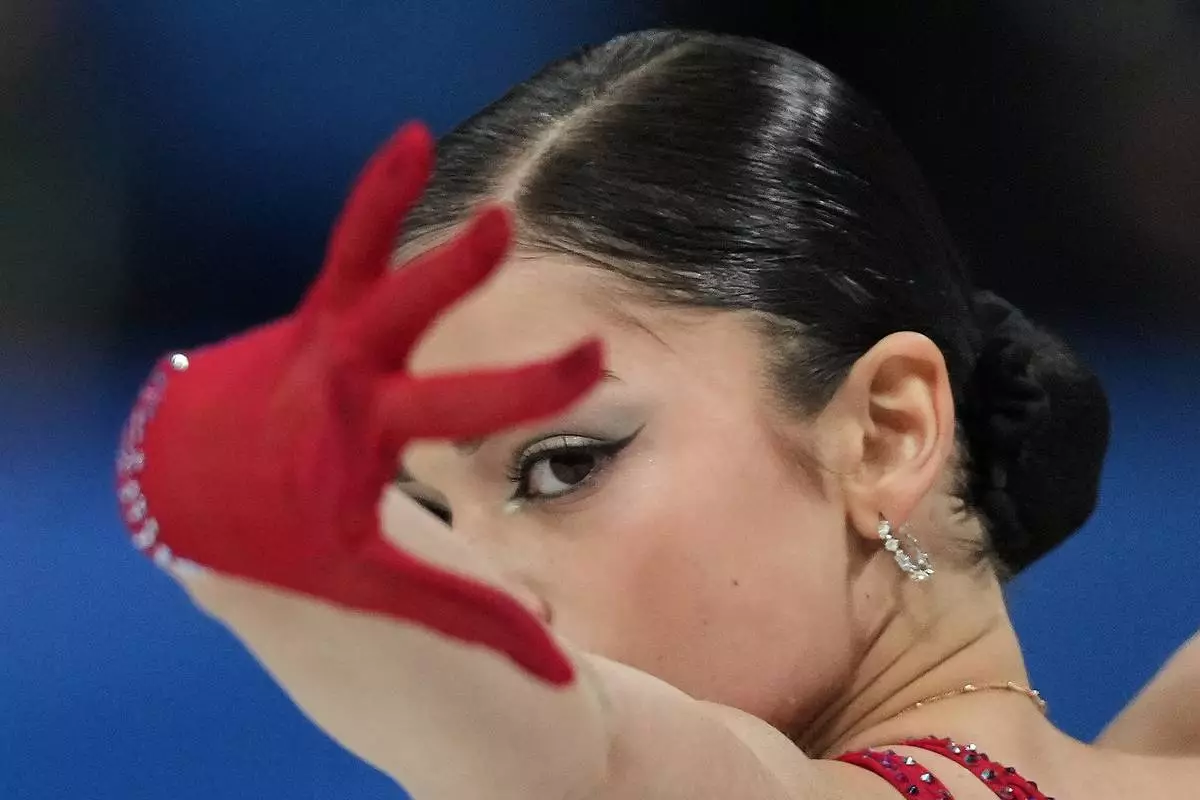 Adeliia Petrosian of Individual Neutral Athletes competes during the women's figure skating free program at the 2026 Winter Olympics, in Milan, Italy, Thursday, Feb. 19, 2026. (AP Photo/Stephanie Scarbrough)