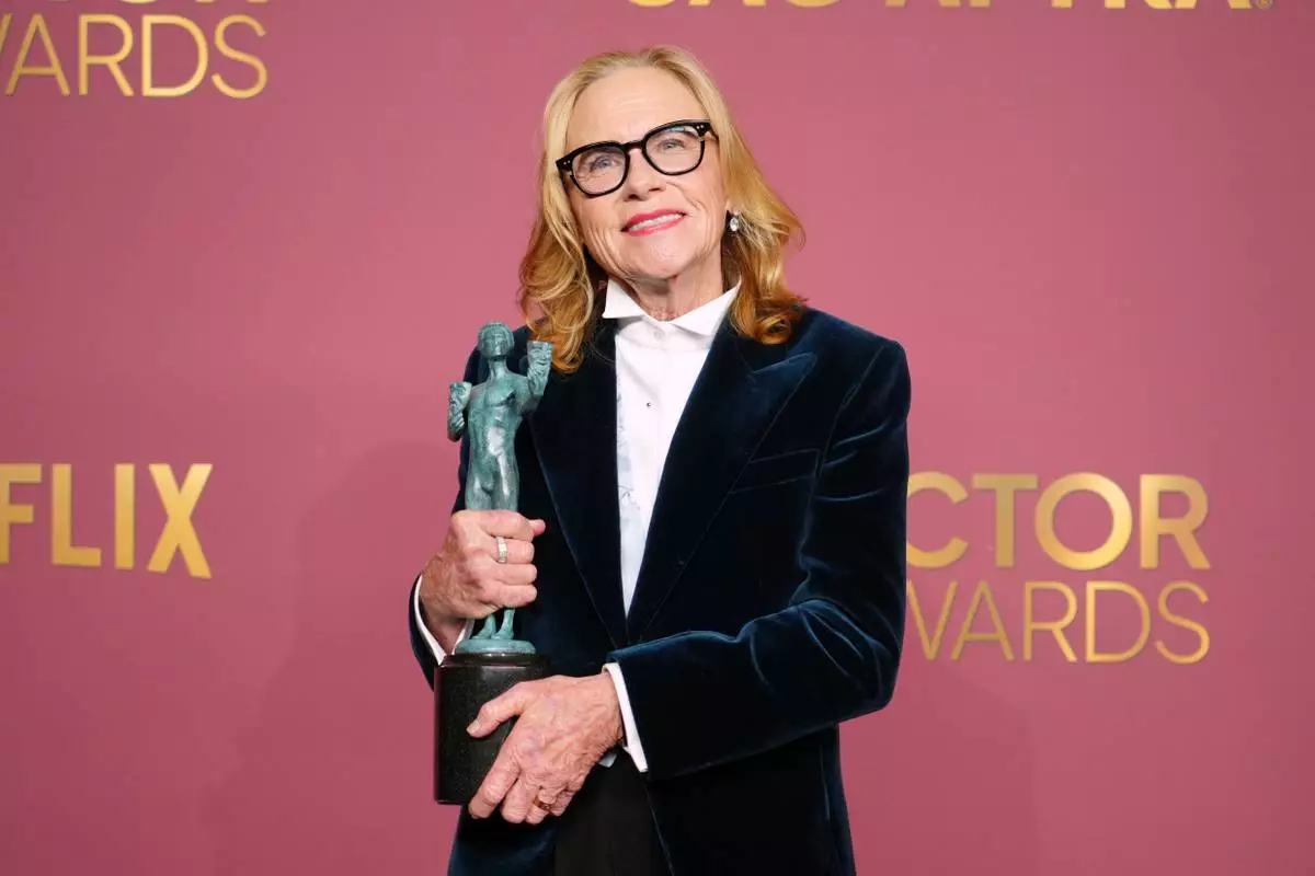 Amy Madigan poses in the press room with the award for outstanding performance by a female actor in a supporting role for "Weapons" during the 32nd Annual Actor Awards on Sunday, March 1, 2026, at the Shrine Auditorium and Expo Hall in Los Angeles. (Photo by Jordan Strauss/Invision/AP)