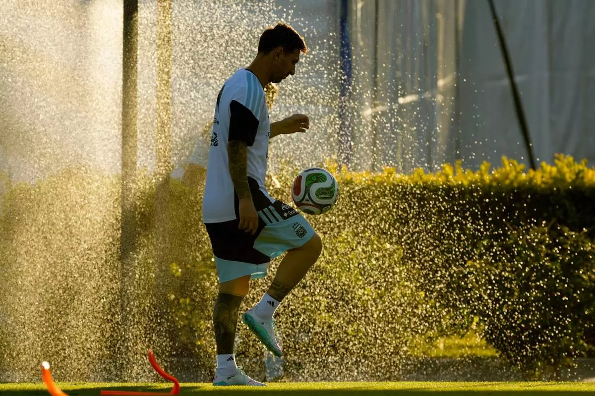 Argentina's Lionel Messi warms up during a training session ahead of an international friendly match against Mauritania, at the Argentina Soccer Association in Buenos Aires, Argentina, Wednesday, March 25, 2026. (AP Photo/Gustavo Garello)