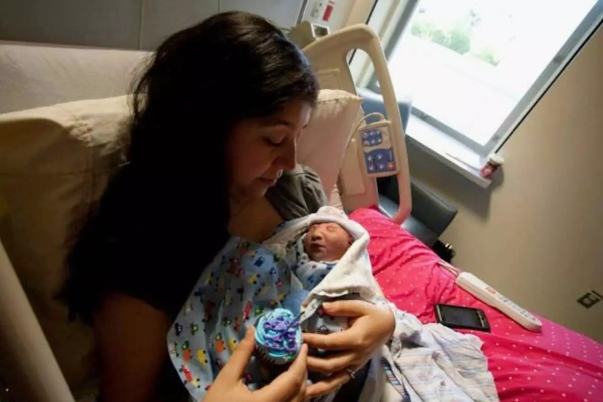 In this photo provided by Andrea Lopez, she cradles her son, Gabriel Cude, at a hospital Bakersfield, Calif., in 2011, where he was born with anencephaly, a rare and severe birth defect tied to a lack of folic acid, a key vitamin. (Courtesy Andrea Lopez via AP) CORRECTION: Corrects last name to Cude, instead of Crude.