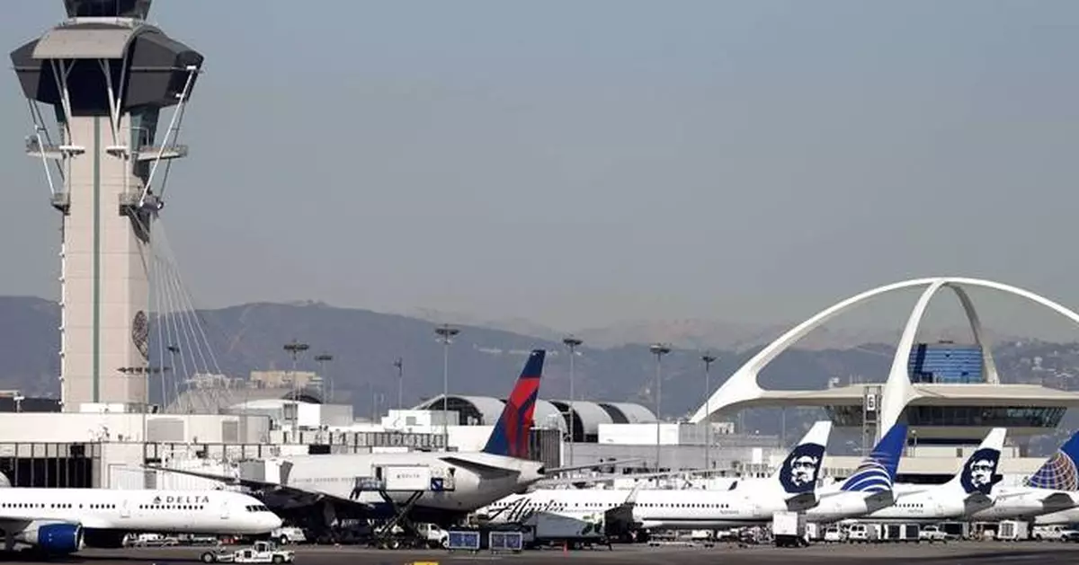 United flight returns to LA airport for an evacuation after a reported fire
