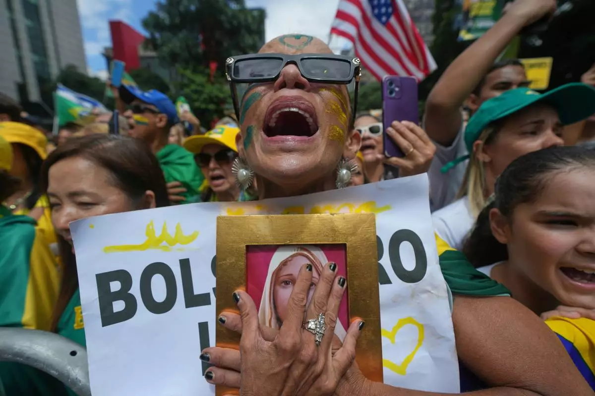FILE - Supporters of former President Jair Bolsonaro protest against President Luiz Inacio Lula da Silva in Sao Paulo, March 1, 2026. (AP Photo/Andre Penner, File)
