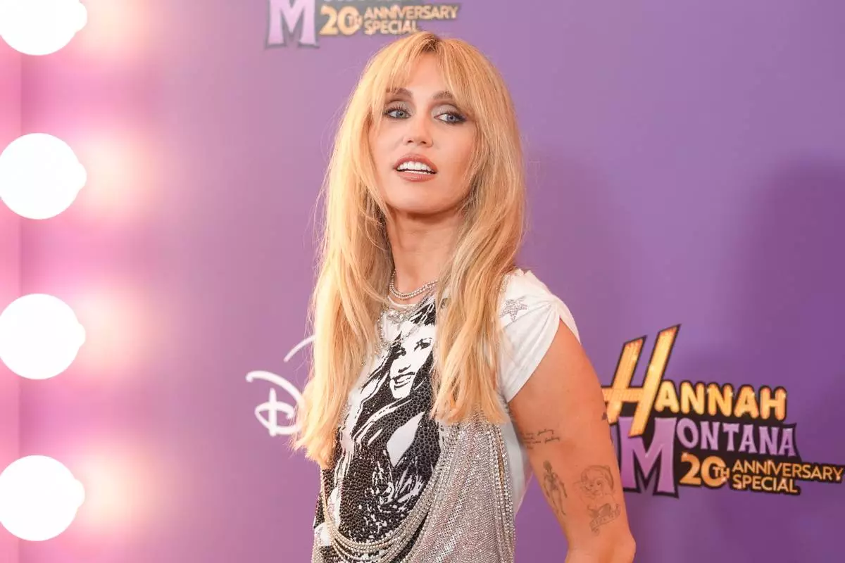 Miley Cyrus arrives at the premiere of "Hannah Montana 20th Anniversary Special" on Monday, March 23, 2026, at El Capitan Theatre in Los Angeles. (AP Photo/Chris Pizzello)