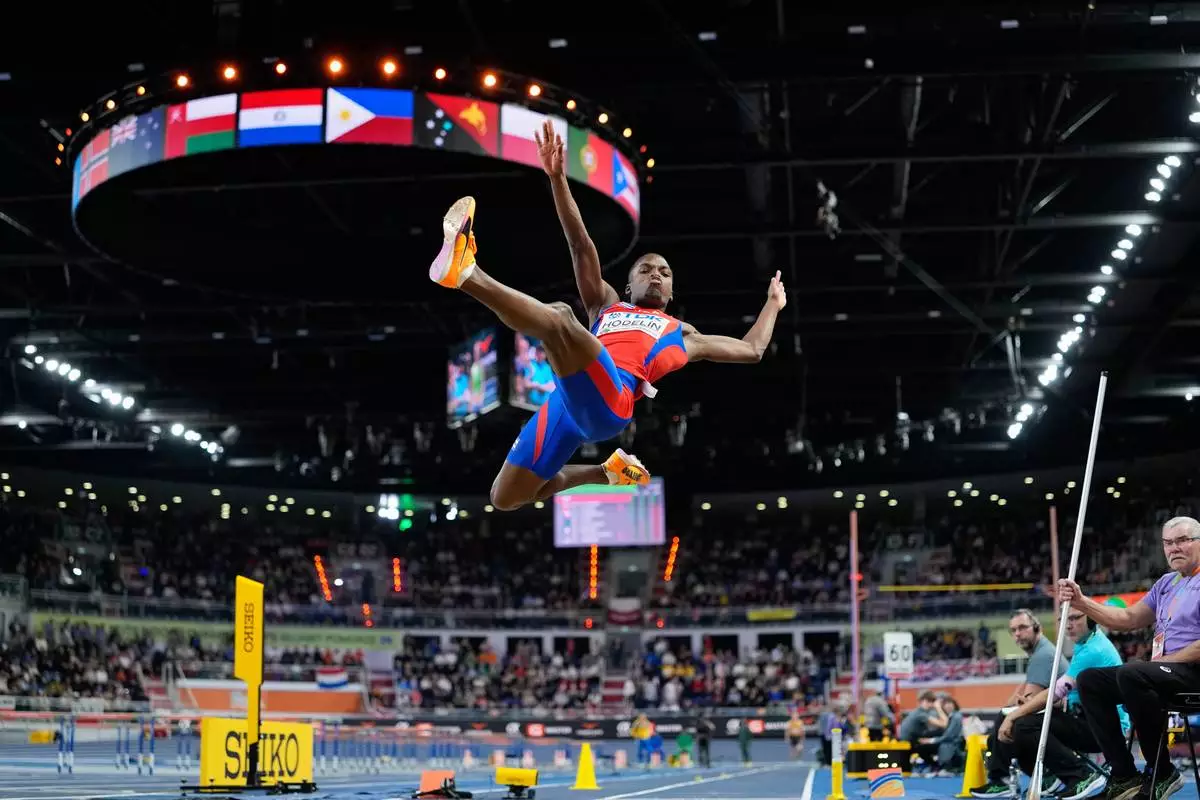 Jorge A. Hodelin, of Cuba, makes an attempt in the men's long jump final at the World Athletics Indoor Championships in Torun, Poland, Sunday, March 22, 2026. (AP Photo/Matthias Schrader)