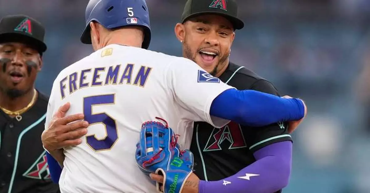 Dodgers' Freddie Freeman gets tagged out with a hug after snapping 0-for-8 skid