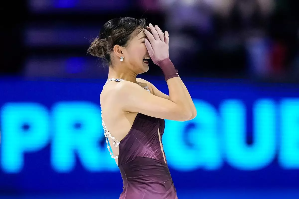 Kaori Sakamoto from Japan reacts at the end of her routine during the women free skating at the Figure Skating World Championships in Prague, Czech Republic, Friday, March 27, 2026. (AP Photo/Petr David Josek)