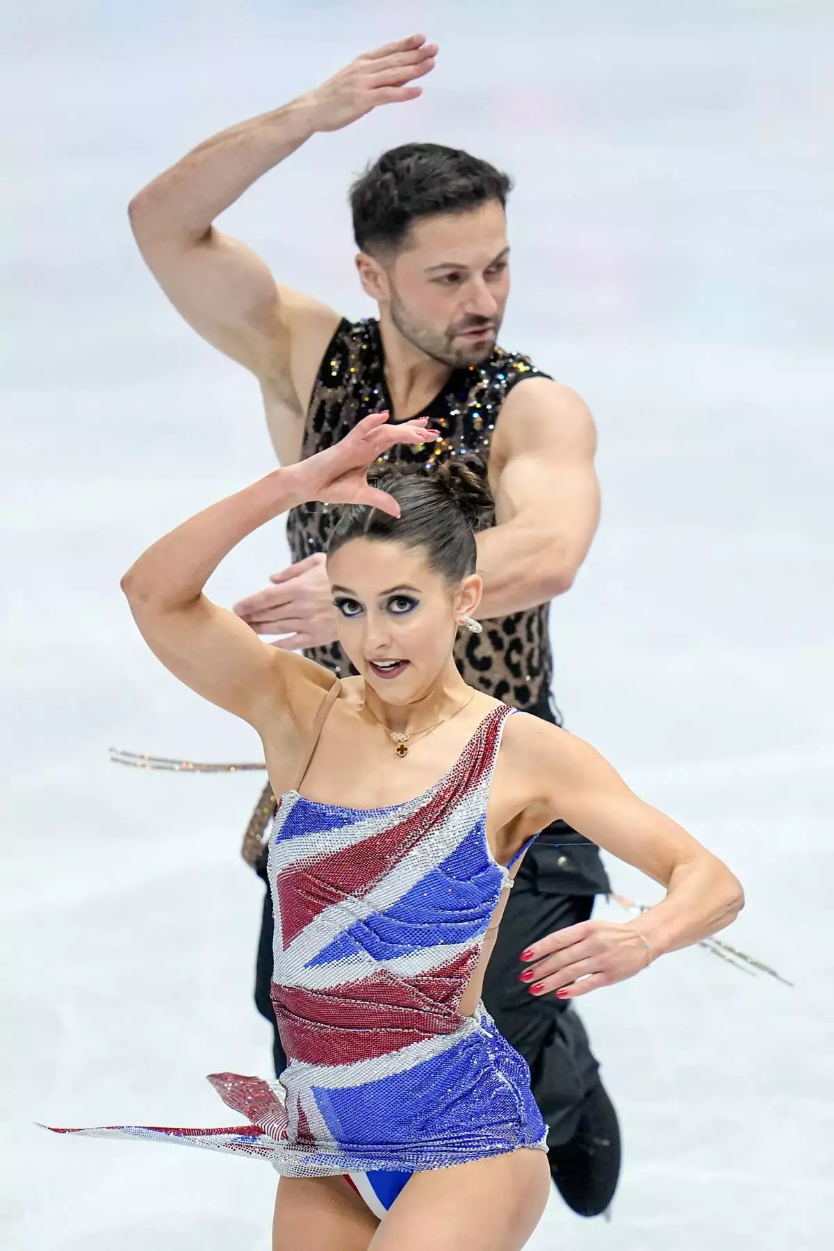 Lilah Fear and Lewis Gibson from Great Britain perform during the ice dance rhythm dance at the Figure Skating World Championships in Prague, Czech Republic, Friday, March 27, 2026. (AP Photo/Petr David Josek)