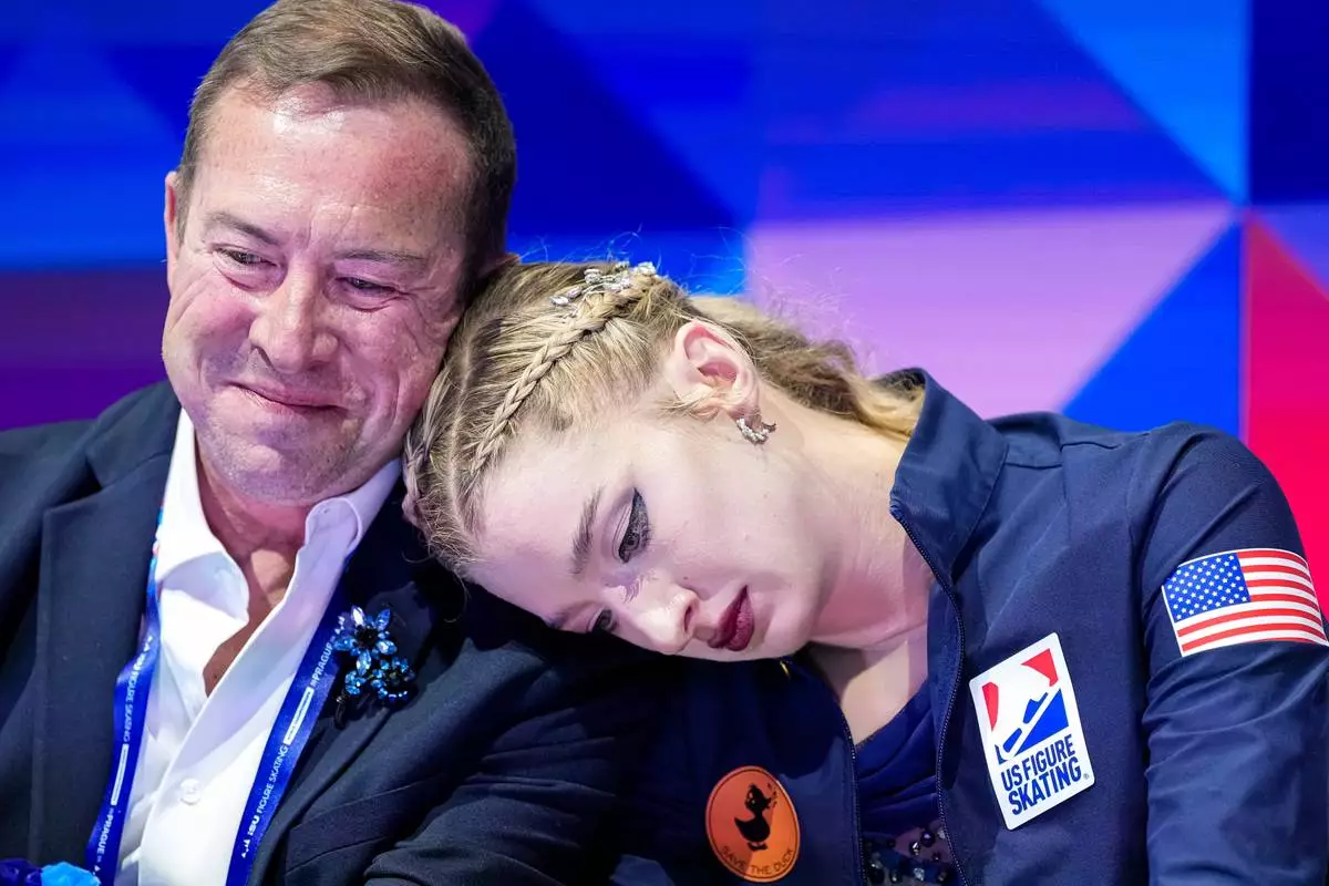 Amber Glenn from the United States reacts at the end of her routine during the women free skating at the Figure Skating World Championships in Prague, Czech Republic, Friday, March 27, 2026. (AP Photo/Petr David Josek)