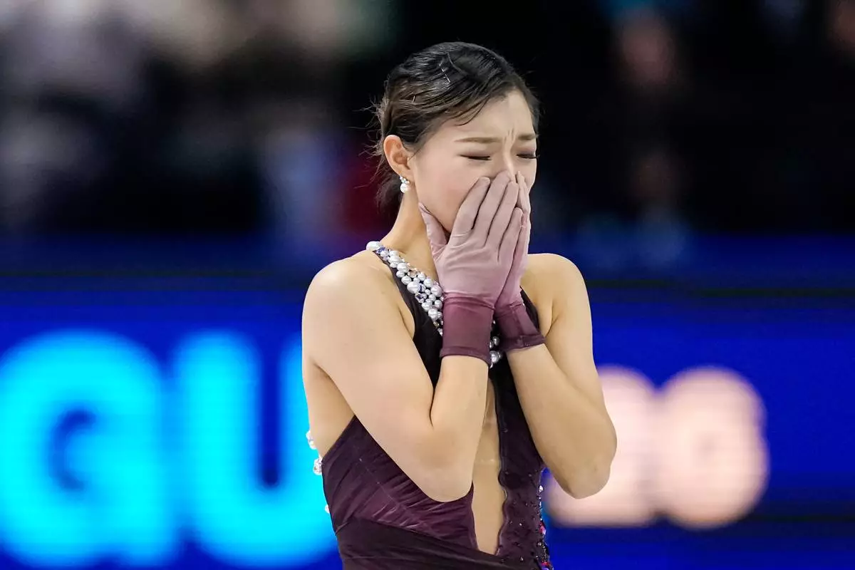 Kaori Sakamoto from Japan reacts at the end of her routine during the women free skating at the Figure Skating World Championships in Prague, Czech Republic, Friday, March 27, 2026. (AP Photo/Petr David Josek)