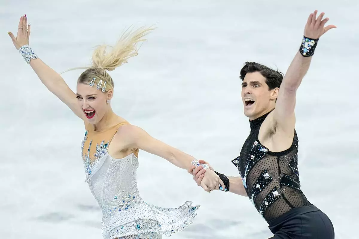 Piper Gilles and Paul Poirier from Canada perform during the ice dance rhythm dance at the Figure Skating World Championships in Prague, Czech Republic, Friday, March 27, 2026. (AP Photo/Petr David Josek)