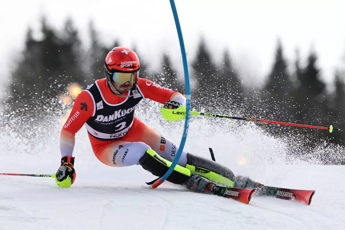 Switzerland's Loic Meillard competes in an alpine ski, men's slalom race, at the Lillehammer World Cup Finals, in Hafjell, Norway, Wednesday, March 25, 2026. (AP Photo/Marco Trovati)