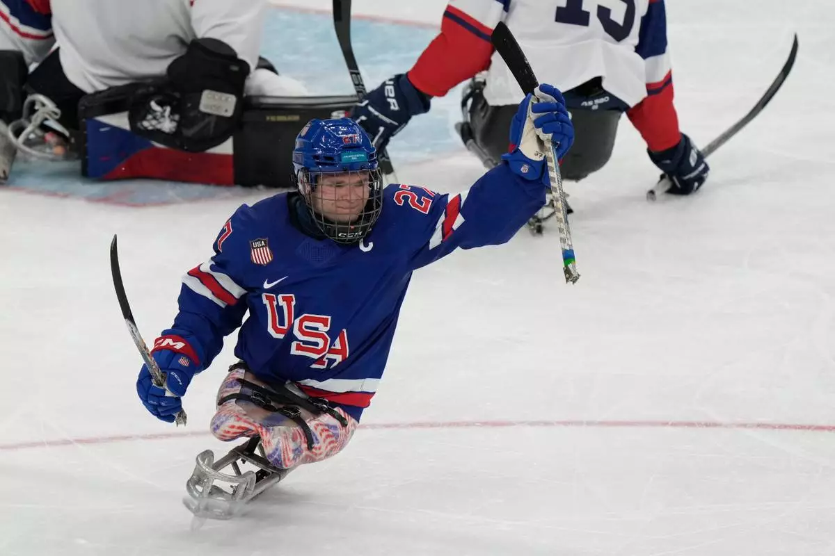 United State's Josh Pauls celebrates after scoring a goal during a semifinal hockey match between United States and Czech Republic at the 2026 Winter Paralympics, in Milan, Italy, Friday, March 13, 2026. (AP Photo/Luca Bruno)