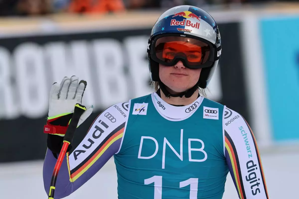 Germany's Emma Aicher reacts at the finish area of an alpine ski, women's downhill race, at the Lillehammer World Cup Finals, in Kvitfjell, Norway, Saturday, March 21, 2026. (AP Photo/Marco Trovati)