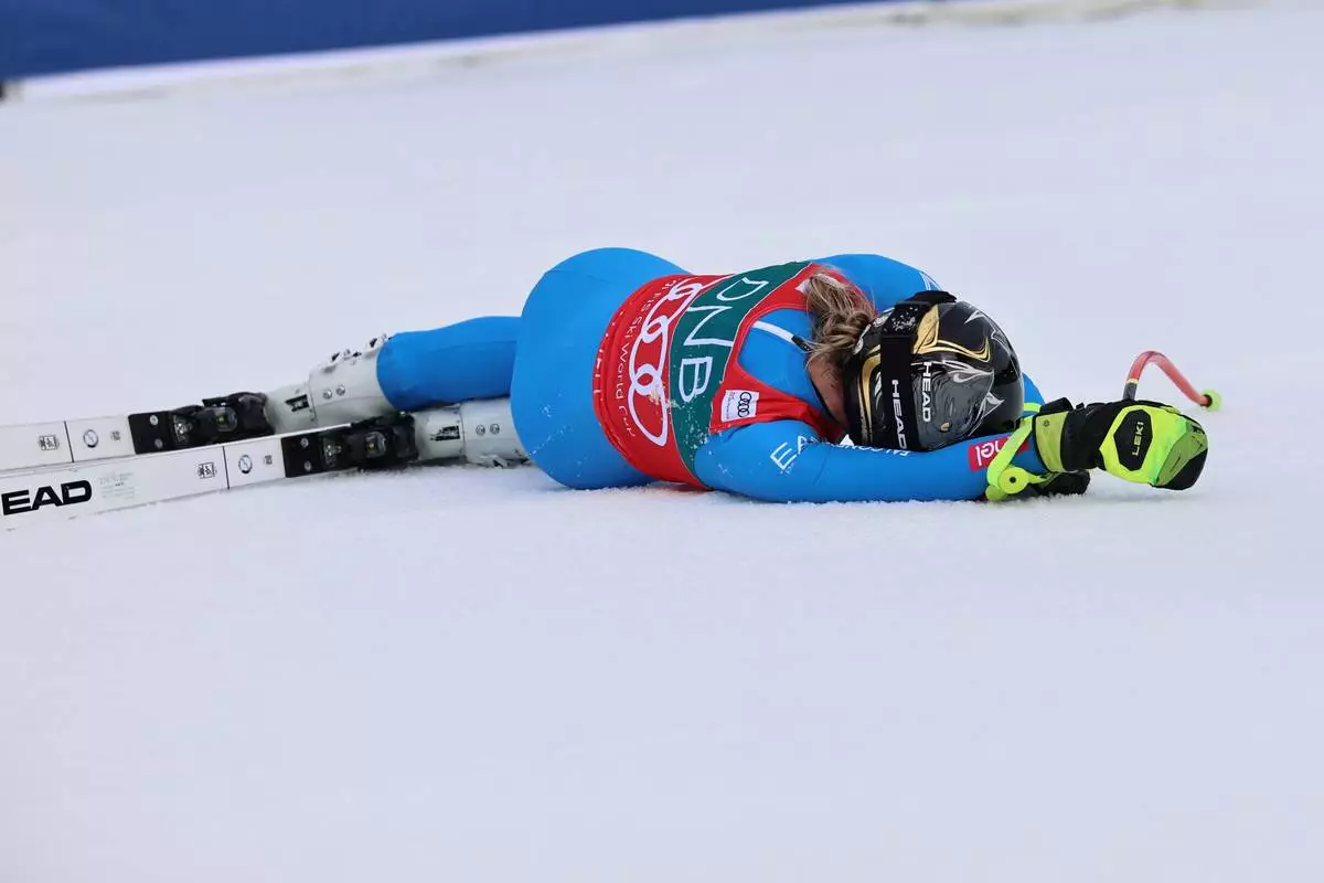 Italy's Laura Pirovano celebrates at the finish area of an alpine ski, women's downhill race, at the Lillehammer World Cup Finals, in Kvitfjell, Norway, Saturday, March 21, 2026. (AP Photo/Marco Trovati)